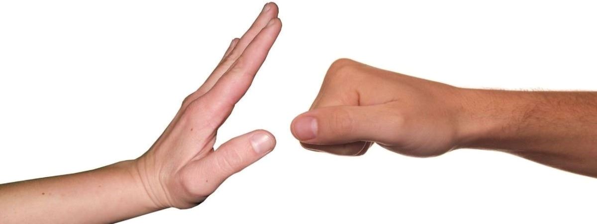 Open hand stopping closed fist  